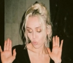 Miley Cyrus Dances in Plunging Black Dress as She Celebrates 'Flowers' Huge Success