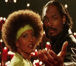 Pam Grier Unveils Snoop Dogg's Exceptional Kissing Skills