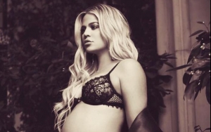 Khloe Kardashian Cradles Growing Baby Bump in Sexy Lingerie Snap Khloe Kardashian Cradles Growing Baby Bump in Sexy Lingerie Snap