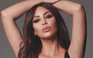 Kim Kardashian Flashes Major Cleavage in Low-Cut Dress at Makeup Launch