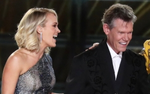 Carrie Underwood Gets a Surprise From Randy Travis at Grand Ole Opry Show