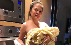 Topless Chrissy Teigen Breastfeeds Newborn Son in Epic Photo