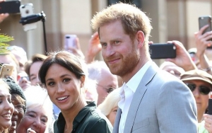 Prince Harry and Meghan Markle Make PDA-Filled Arrival in Australia for First Royal Tour