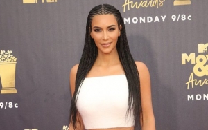 Where's Kanye? Kim Kardashian Shares New Picture With Very Naked Hunk