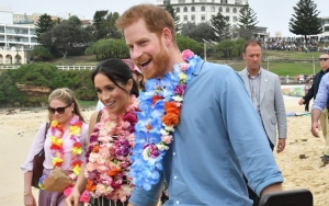 Prince Harry Is Easily Lifted by an American Sailor in Bear Hug, Pregnant Meghan Markle Is Amused