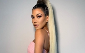 Kourtney Kardashian Sparks Pregnancy Rumor After Seen Cradling and Covering Stomach in Pics