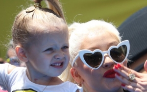 Watch: Christina Aguilera Has Sweet Interaction With Daughter at Missouri Concert