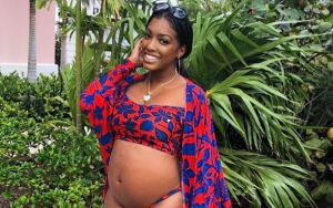 Porsha Williams Flaunts Her Bare Baby Bump in Colorful Bathing Suit During Babymoon