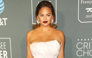 Chrissy Teigen Looks Embarrassed After Getting Scolded for Bartending at 2019 Critics' Choice Awards