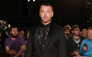 New BF? Sam Smith Holds Hands With Mystery Man on 2019 GQ Men of the Year Awards Red Carpet