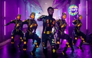 Lil Nas X Bids Farewell to Cowboy Life Through Futuristic 'Panini' Music Video