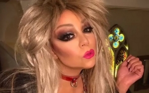 Mariah Carey Wears Glam Rock as She Gets Call From Santa Himself