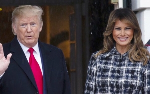 Video: Melania Trump Forcefully Yanks Her Hand Out of Donald's Hand at Football Championship