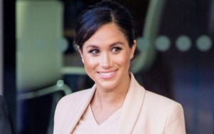 Meghan Markle All Smiles in First Pics Since Royal Exit as She Skips Royal Family Meeting