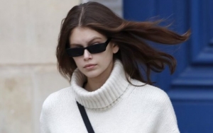 Kaia Gerber Pregnant at 18? She Reads Parenting Book and Appears to Show Tiny Baby Bump
