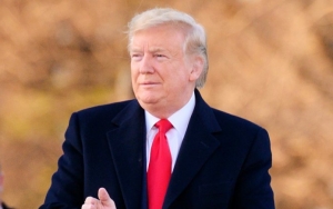 Donald Trump Appears to Be Disrespecting National Anthem at Super Bowl Watch Party