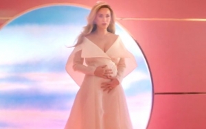 Katy Perry Unveils First Pregnancy Through 'Never Worn White' Music Video