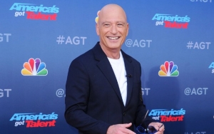 Howie Mandel Wears Hazmat Suit and Gas Mask After Poking Fun at Coronavirus Victim