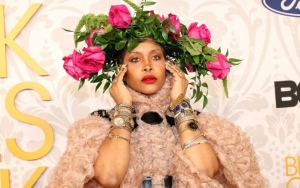 Erykah Badu Gives Couture Spin to Her Travelling Hazmat Suit