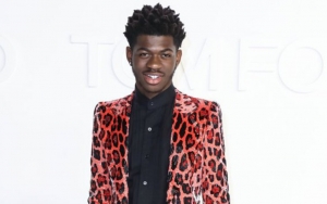Lil Nas X Transforms Into a Sexy Santa in Red Latex Outfit