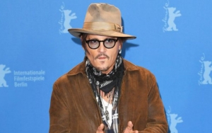 Johnny Depp Accepts Award Behind Bars in Bizarre Photo After Losing Libel Suit