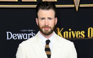 Chris Evans Grimacing as He Swabs Himself for COVID test
