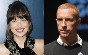 Dakota Johnson Sparks Chris Martin Engagement Rumor With Massive Sparkler