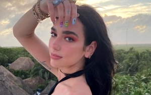 Dua Lipa Shrugs Off Pregnancy Rumors Caused by Cryptic Baby Emoji Caption