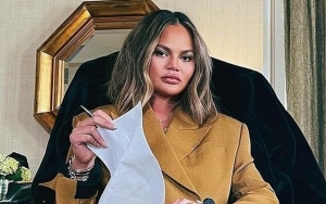 Chrissy Teigen Knocks Out Her Tooth While Eating Late-Night Snack