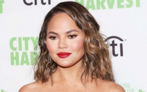 Chrissy Teigen Debuts New Pastel Pink Hair in NSFW Picture
