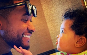 Usher All Smiles in Rare Pic With His Third Child 