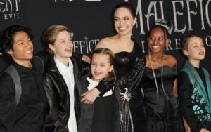 Angelina Jolie Keeps It Chic in Black Dress During Paris Outing With Her Kids
