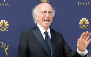 Larry David Sparks Chatter After Spotted Plugging Ears at New York Fashion Week Event