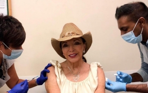 Joan Collins Encourages Others to Get COVID-19 Vaccine Booster After Receiving Hers