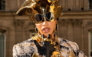 Cardi B's Green Catsuit During Paris Fashion Week Sparks a Hilarious Meme Fest