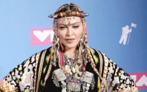 Madonna Gives Middle Fingers After Trolls Criticize Her for Looking Like Teenager in Photos