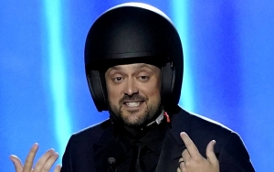 Grammy Presenter Nate Bargatze Wears Helmet Onstage as He Pokes Fun at Will Smith Oscars Slap