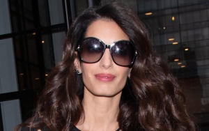 Amal Clooney on Opening Up About Periods With Her Daughters: 'It's Science'