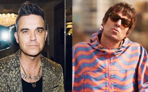 Robbie Williams Ignites Liam Gallagher Feud With Knebworth Show Diss