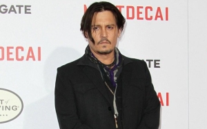 Johnny Depp Looks Disheveled as He's Escorted Out of Hotel