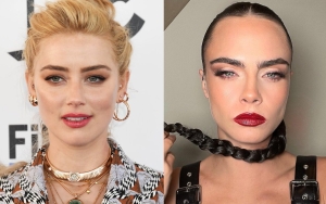 Photos Appearing to Show Amber Heard Making Out With Cara Delevingne in Elevator Go Viral