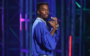 Is Playboi Carti Kissing a Male Fan Onstage?