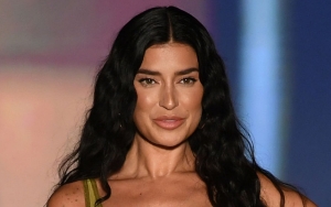 Nicole Williams Shows Off Baby Bump on Sports Illustrated Runway for Surprise Pregnancy Revelation
