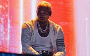 Chris Brown Laughs at Himself After Ripping Pants on Stage