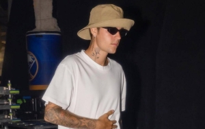 Justin Bieber Spotted With Pants Around Knees Behind Tree at Golf Club