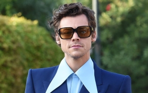 Harry Styles Covers Ripped Glittering Jumpsuit With Pride Flag During Brazil Show