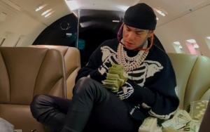 6ix9ine Leaves Fans Baffled After Revealing His Address While Flexing $1M in Cash