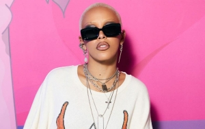 Doja Cat Covered in Red Paint and 30,000 Swarovski Crystals for 'Magical' Look at Paris Fashion Week