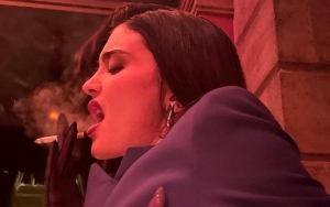 Kylie Jenner Raise Fans' Eyebrows as She Smokes Cigarette in Fashion Week Behind-the-Scenes Picture 