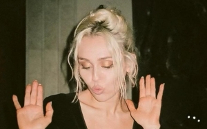 Miley Cyrus Dances in Plunging Black Dress as She Celebrates 'Flowers' Huge Success